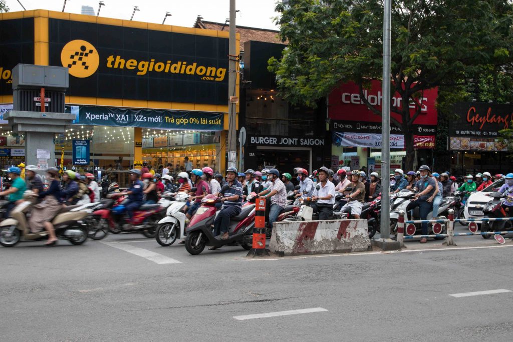 Street filled with scooters in ho chi minh city