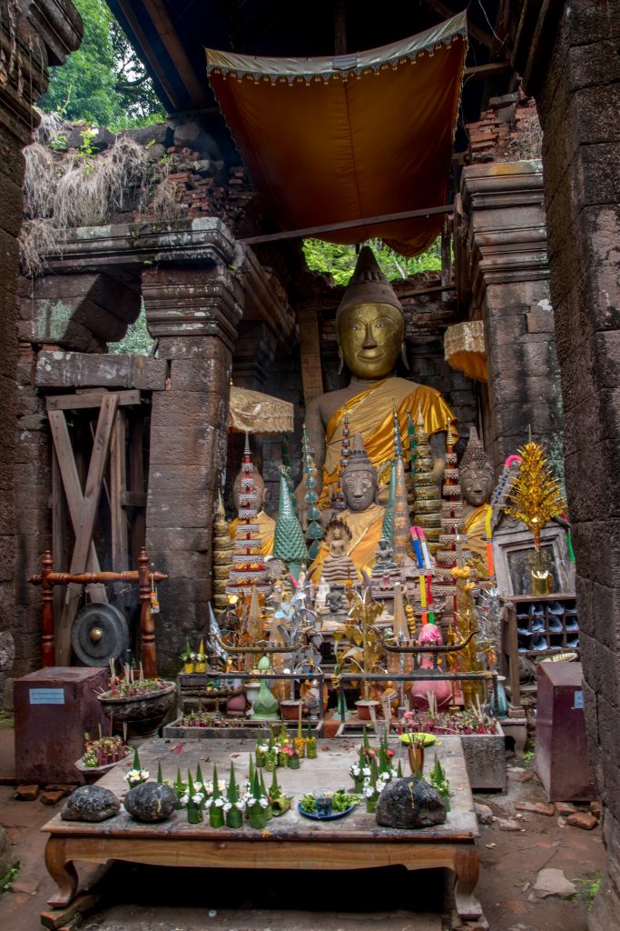 Statue of Buddha in wood at the heart of the sanctuary of Wat Phou to Champasak in Laos