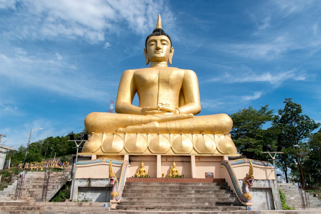 Giant Buddha Golden on the heights of Pakse in Laos