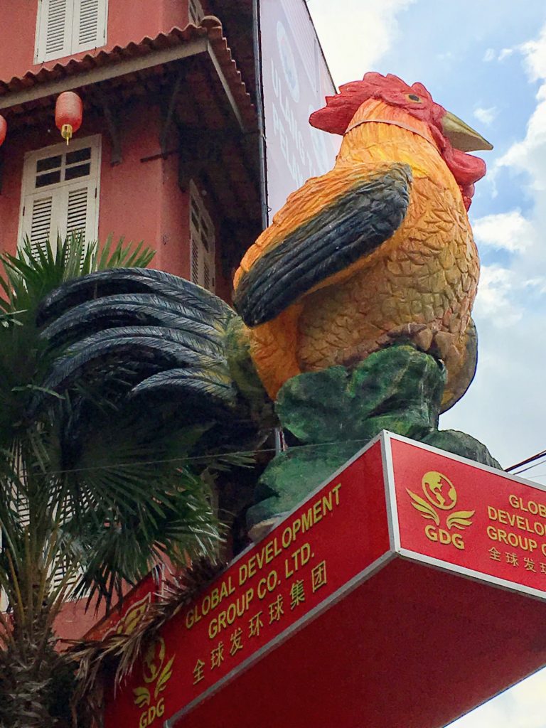 Rooster at the entrance to Chinatown in Melaka in Malaysia