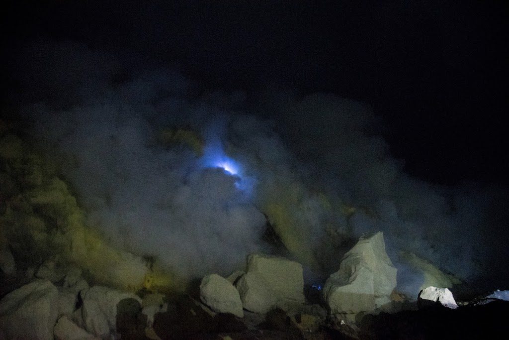 Spectacle of the Blue Flames in the heart of the crater of the Kawa Ijen in Indonesia