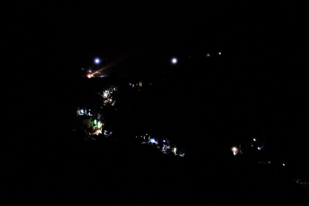 Several hundred tourists descending at night in the crater Kawa Ijen to see the spectacle of the Blue flames